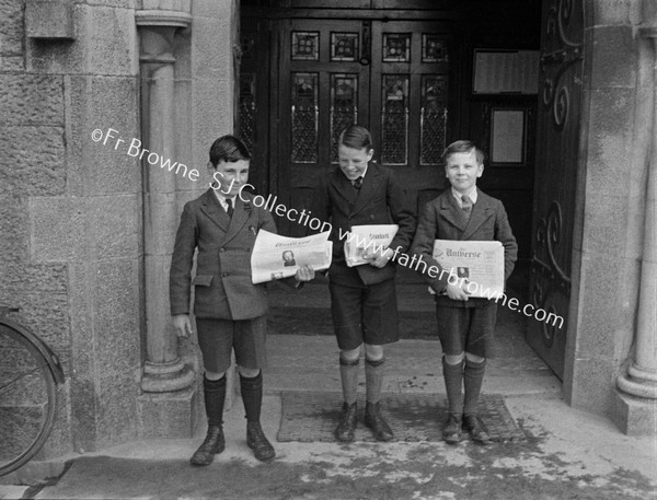 BOYS WITH STANDARD NEWSPAPER